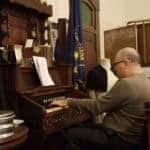 Guest organist Jim Kemp played the building's original pump organ to accompany the carol singing.