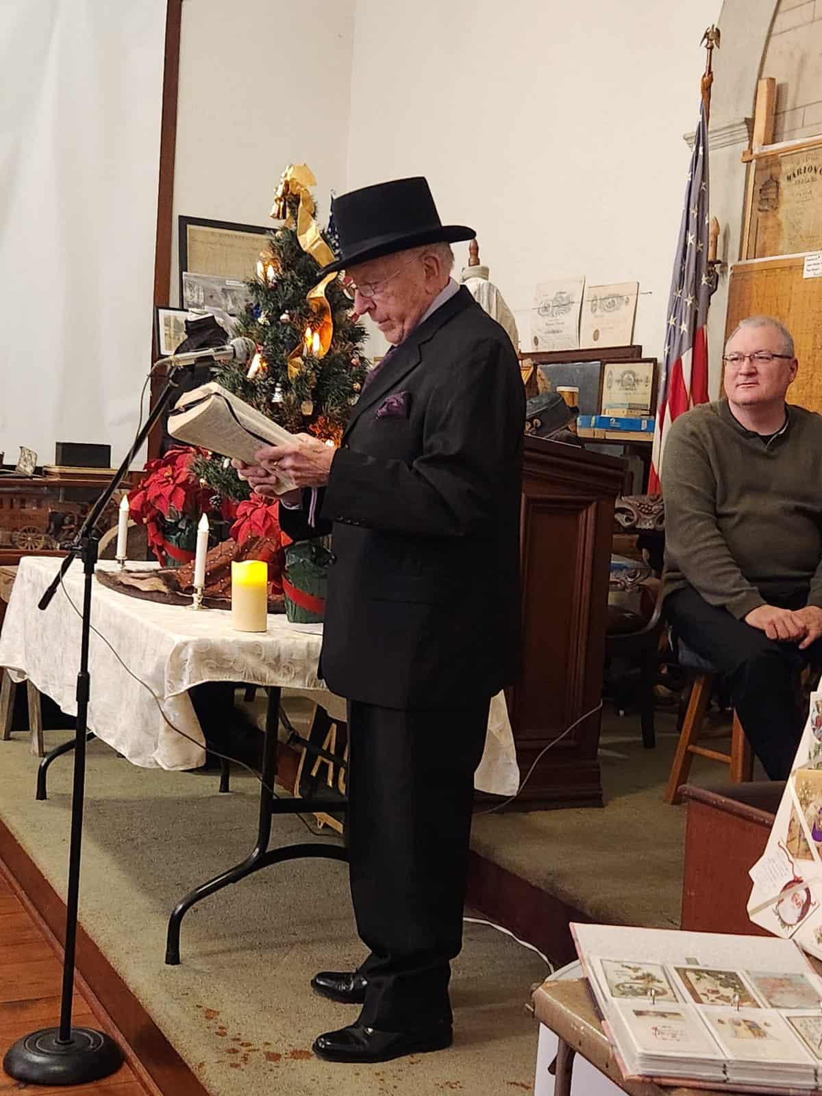 FTHS board member Arvine Tolle reads the Christmas story from Luke 2