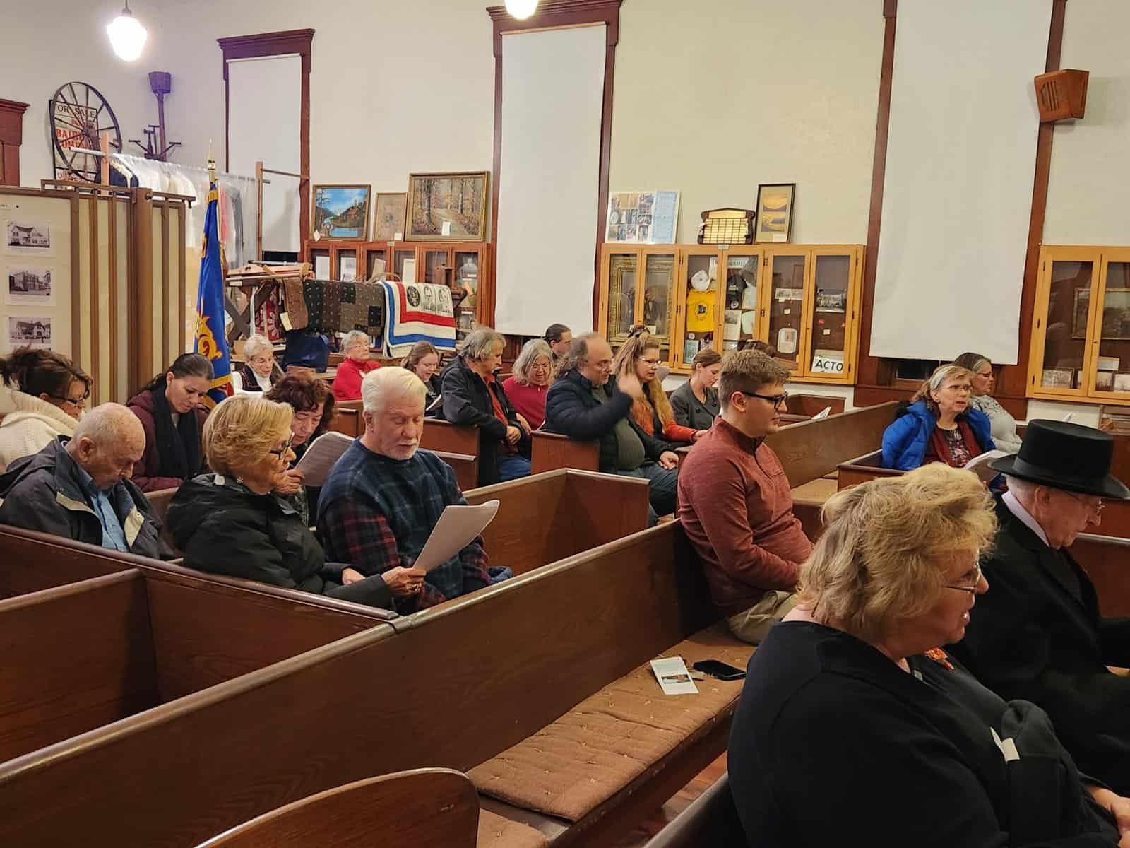 Visitors sing Christmas carols