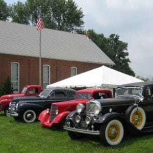 cars on meeting house lawn
